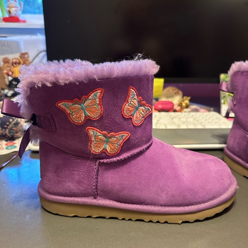 UGGS in purple w butterflies. In great shape. Kids 6 fits womens 8